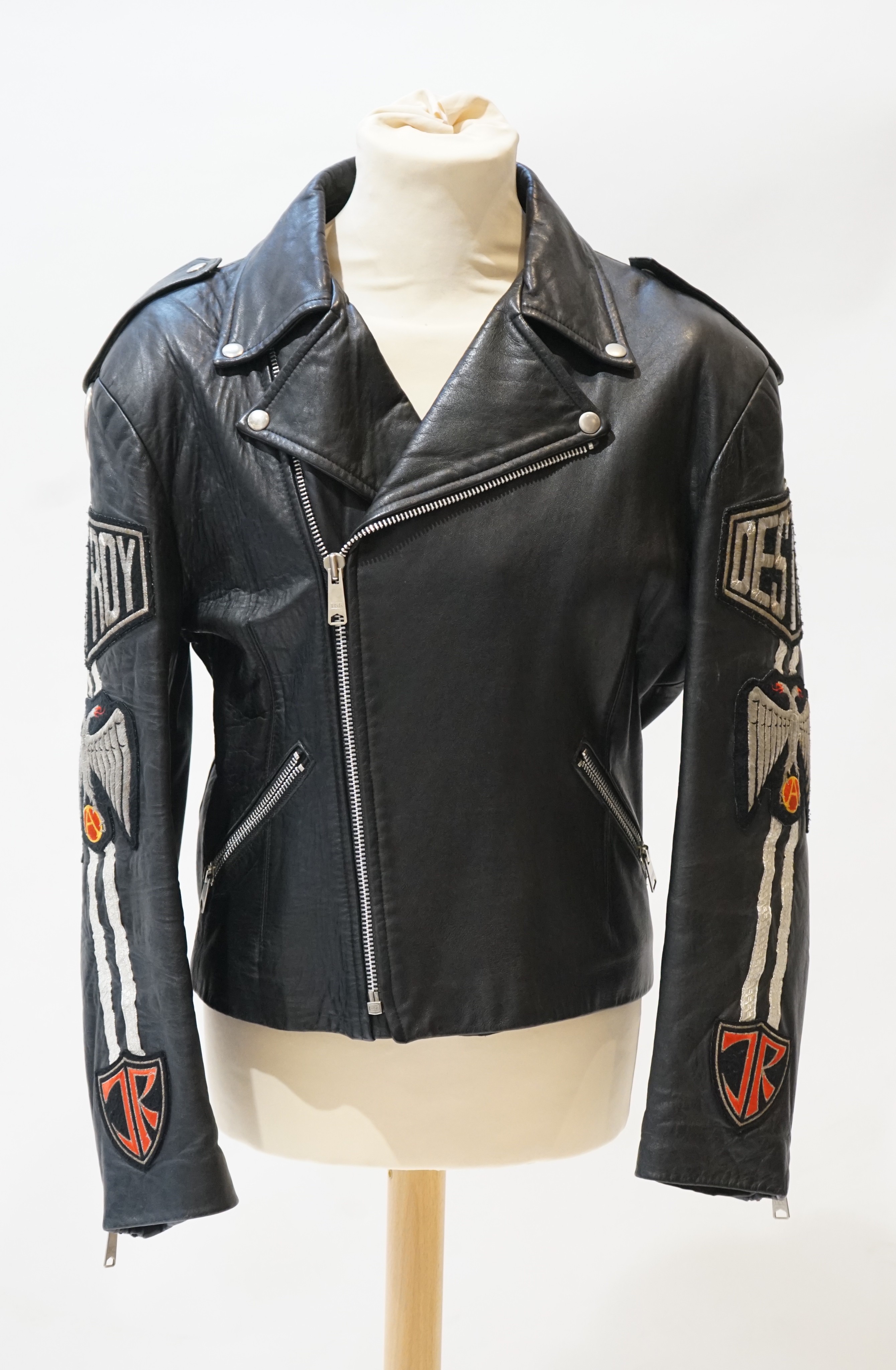 A gentleman's John Richmond black leather biker jacket with 'Destroy' embroidered arms, size L